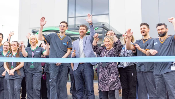 Blaise team members cutting ribbon for opening